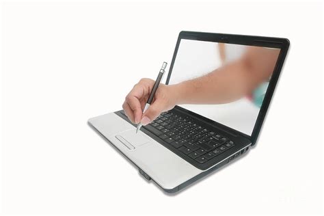 A Hand Is Writing And Through The Computer Screen Digital