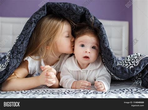 two sisters lying on image and photo free trial bigstock