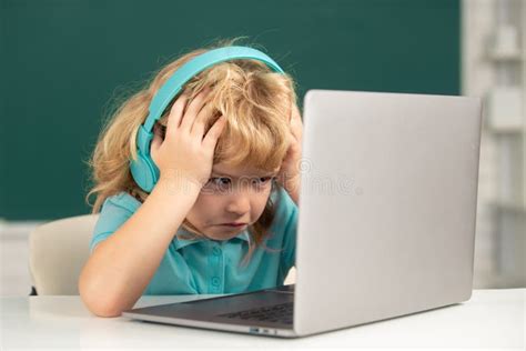 Angry Sad Child Using Laptop Computer Kid Boy Studying Through Online