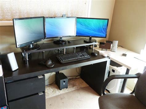 Black Ikea Computer Desk Setup With Triple Monitor Stand For Multiple