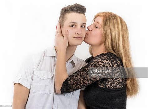 Mother Kissing Son High Res Stock Photo Getty Images