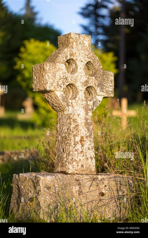 A Stone Tombstone In The Shape Of A Celtic Cross At St Mary Magdalene
