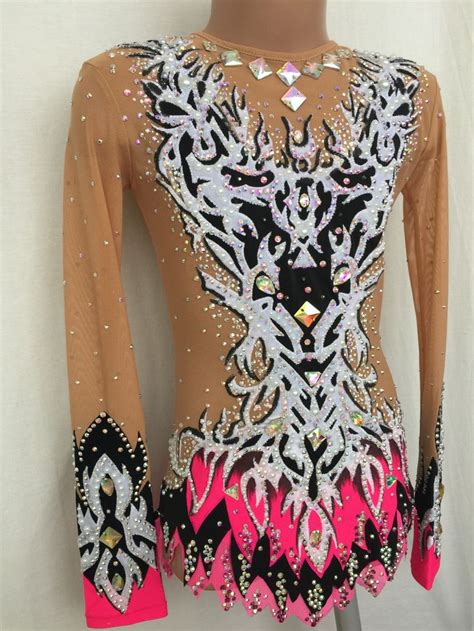 A Womans Top With Sequins And Feathers On It