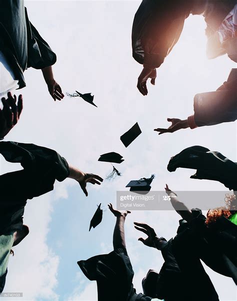 Stock Photo Five Students Throwing Their Mortar Boards In The Air At