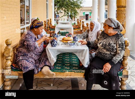 A Small Group Of Uzbek Women Eating Lunch At A Cafe Inside The Main