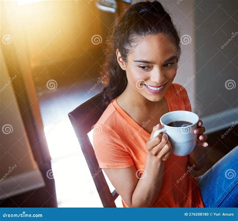 Theres Nothing Better Than A Great Cup Of Coffee A Smiling Young Woman Drinking Coffee While