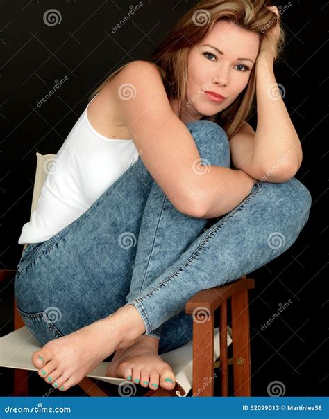 Relaxed Beautiful Young Woman Sitting In A Chair Stock Image Image Of Modeling Looking 52099013