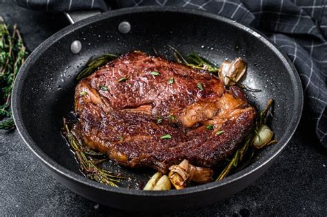 Roasted Rib Eye Steak Ribeye Beef Meat In A Pan Black Background
