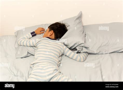 Asian Boy Sleeping In Bed Hi Res Stock Photography And Images Alamy