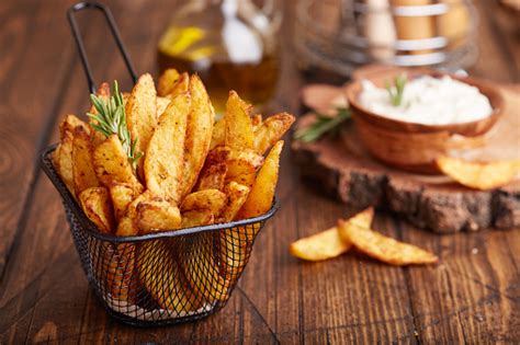 You can bake the potatoes directly on the oven rack, or you can place them a few inches apart on bake the potatoes for 50 to 60 minutes. Potato Wedges Baked With Rosemary Fast Food Stock Photo ...