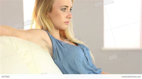 Beautiful Blonde Teen Relaxing On The Couch Stock Video Footage