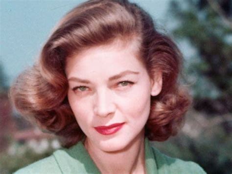 An Old Photo Of A Woman With Short Hair Wearing A Green Shirt And Red