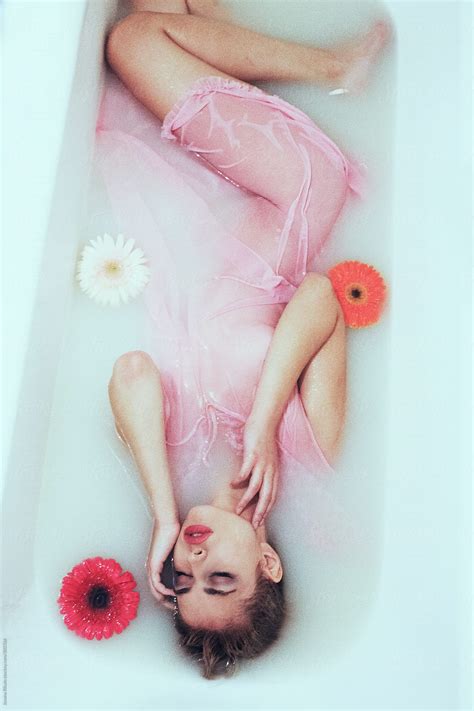 An Attractive Young Woman Lies In Milk Bath By Jovana Rikalo Stocksy United