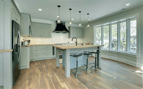 A rustic kitchen with oak cabinetry can be enhanced by the ambient lighting. Green Kitchens Ideas for a Lively Space
