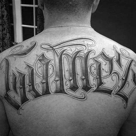 The Back Of A Mans Upper And Lower Back Tattoos