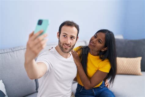 Man And Woman Interracial Couple Making Selfie By Smartphone At Home