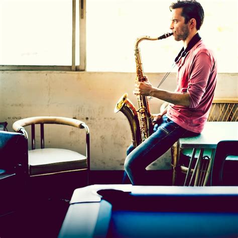 Premium Photo A Musician Guy Playing Saxophone Alone