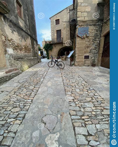 Bicycle Parked In The Middle Of A Cobble Stone Street In An Old