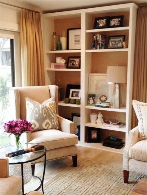 How to decorate a hole in the wall. Living room shelving. Buy shelves and knock the back out. A great way to decorate without ...