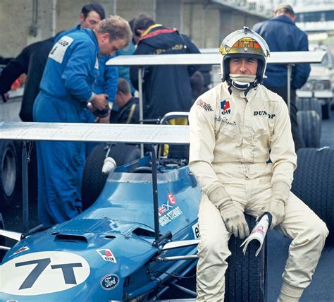 Jacke Stewart Sits On The Tire Of His Matra Ford Ms80 In Brands Hatch