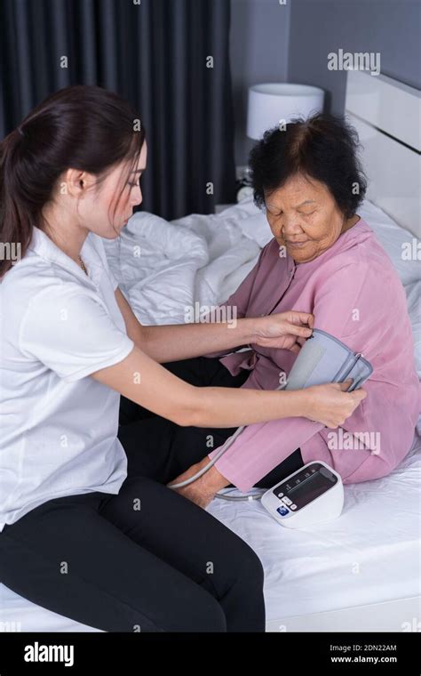 Nurse Checking Patient Stock Photo Alamy