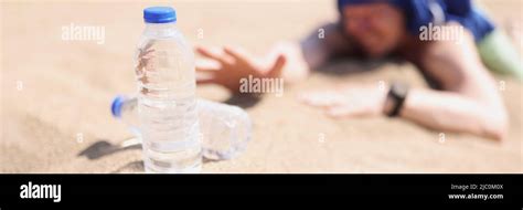 Man Lying On Sand In Desert And Feeling Thirst Stock Photo Alamy