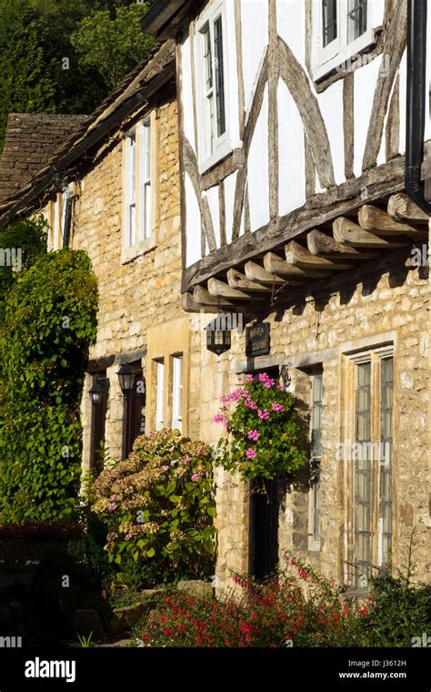 Quaint Stone Cottages Line The Street In Castle Combe The Cotswolds