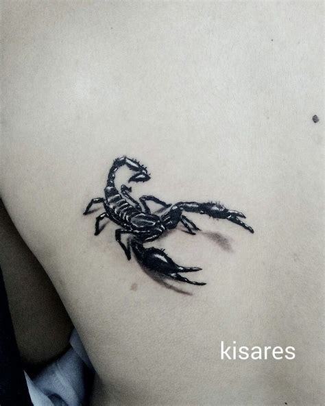 A Scorpion Tattoo On The Back Of A Man