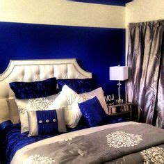 A red and marigold bedroom with carved wooden furniture and a. Royal Blue, silver, white grey. I'm completely obsessed in ...