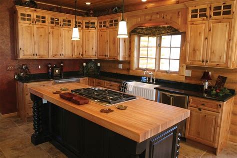 Maple kitchen cabinets add spark to your kitchen remodeling project. Image result for white kitchen island black countertop maple cabinet | Log home kitchens, Pine ...