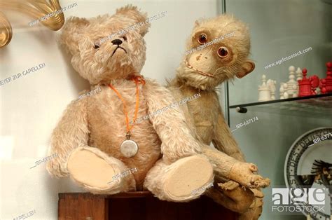 Two Old Worn Stuffed Animals Teddy Bear And Monkey Plush Toy At An