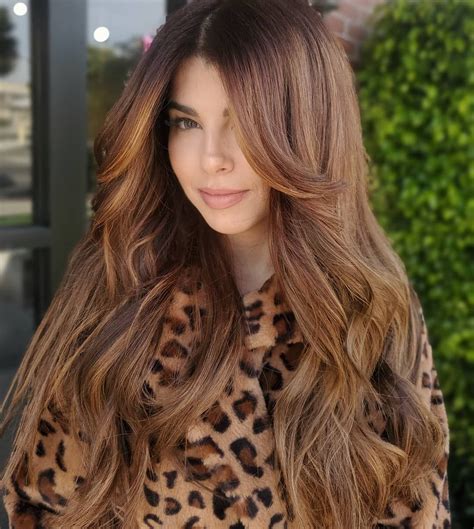 This hairstyle has a strong middle and parts down the center. 50 Best Layered Haircuts and Hairstyles for 2020 - Hair Adviser in 2020 | Hairstyles for layered ...