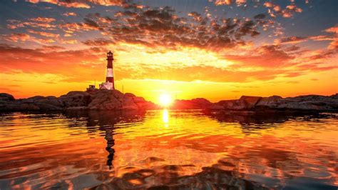 Lighthouse Sunset Sunlight Ocean Rocks Stones Clouds Hd