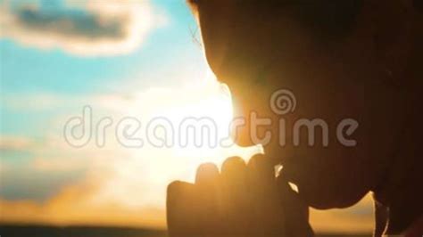 Girl Praying Girl Folded Her Hands In Prayer Silhouette At Sunset