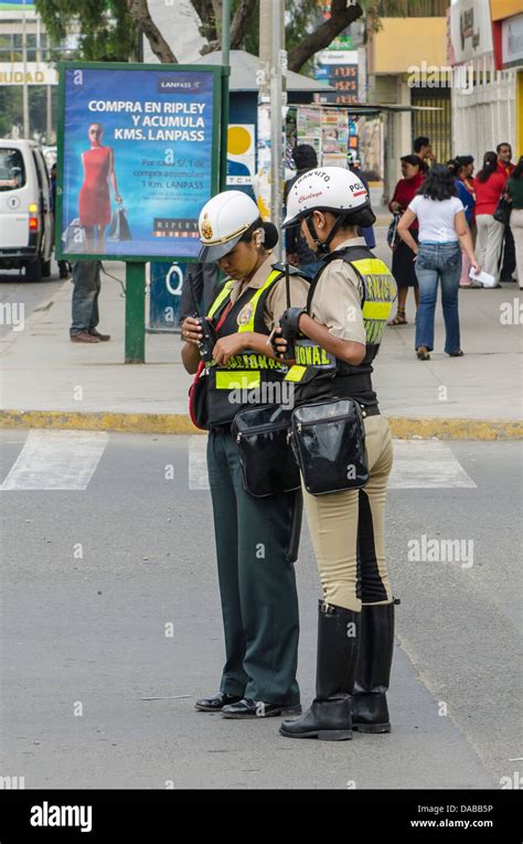 Police Women Patrolling Directing Traffic On The Street In Chiclayo