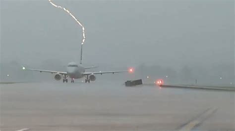 watch the moment it hits plane caught struck by lightning weather news