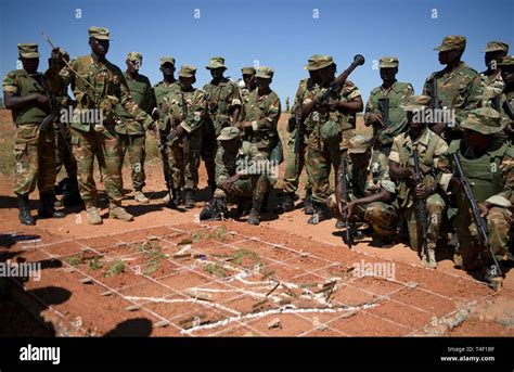 Zambian Soldiers Go Over A Pre Mission Brief Before Heading Out On
