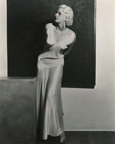 jean harlow in one of her signature satin gowns poses for famed photographer russell ball in