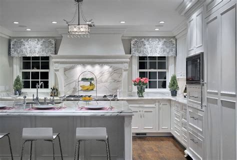 This kitchen carves out a clean, clinical space that contrasts with the rest of the open floor plan. 41 White Kitchen Interior Design & Decor Ideas (PICTURES)