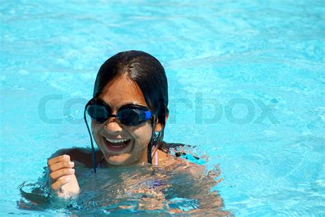 Happy Teen Girl With Goggles Blue Swimming Pool Portrait Stock Image