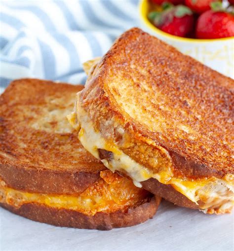 2 grilled cheese sandwiches on a plate in 2021 | Air fryer recipes easy