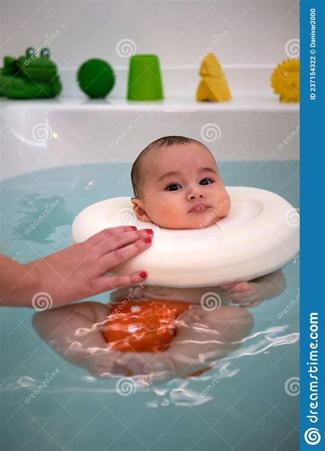 Baby Enjoying In The Jacuzzi Spa For Babies Hydrotherapy Session For