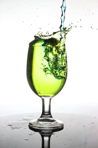 Premium Photo Green Water Splash In Wine Glass