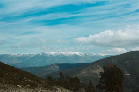 Mesmerizing Scenery Of The Green Hills With The Snow Capped Mountains