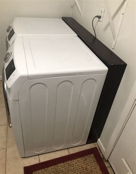 Stacked washer and dryer behind curtains cottage laundry room. Cute laundry room shelf i worked on to hide all of the ...