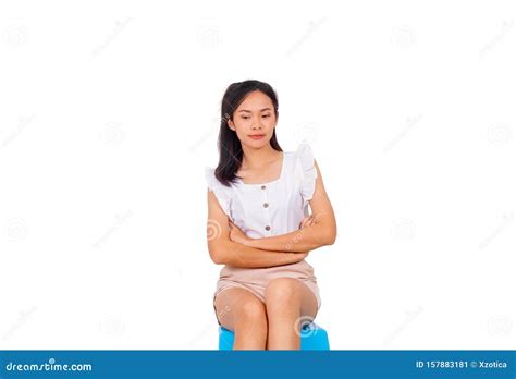an asian girl in white sitting on blue stool bare feet stock image image of casual healthy