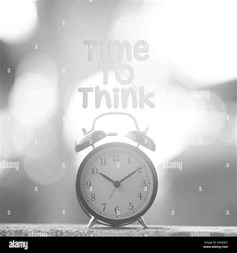 Black Alarm Clock With Time To Think Word Concept Of Time Stock