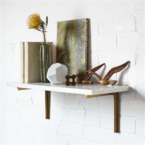 Home improvement expert ron hazelton demonstrates how to install floating shelves with invisible brackets, so shelves have the appearence of floating. A Brass Shelf Two Ways: Remodelista