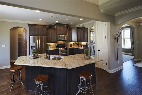 From cleverly concealed appliances to unique cabinetry hues, explore the latest trends and styles for your kitchen. Regency Homebuilders : Open Concept Living, Large Kitchen, Dark Cabinets, Staggered Cabinets ...