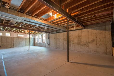 Unfinished basement offices allow you to use as much or as little of the space for an office. highcraft-builders-unfinished-basement-main-room - HighCraft
